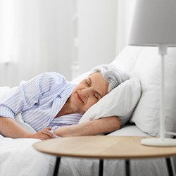 A woman resting in bed