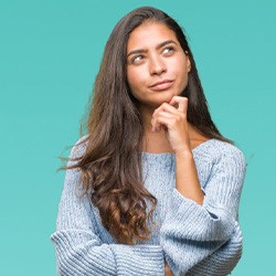 Woman tapping her chin