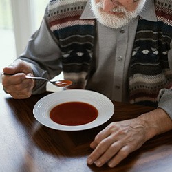 A man eating soup