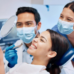a patient undergoing in-office teeth whitening treatment