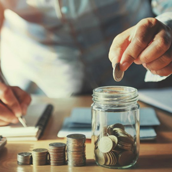 Patient dropping a coin into a mason jar